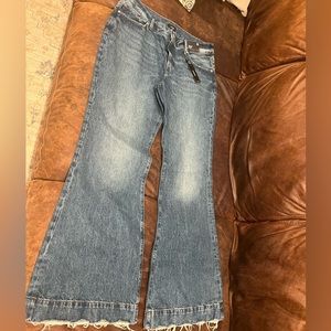 Mid Rise Medium Wash Raw Hem 70s Flare Jeans. By Express, size 12.